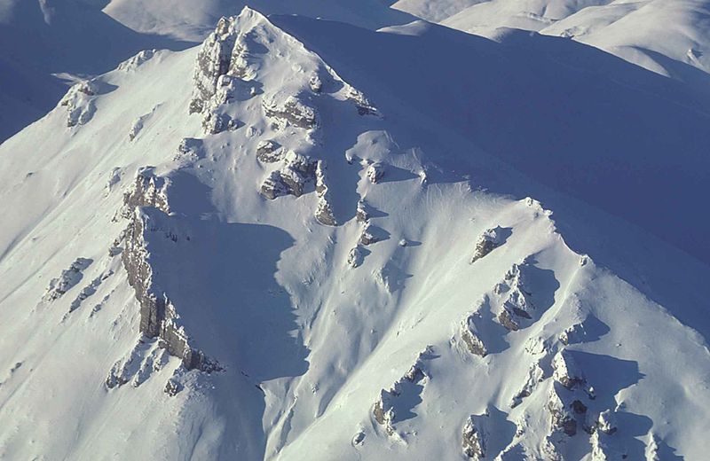 File:Mountain peaks covered with snow and ice aerial view.jpg