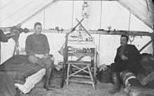 Mounted police deployed to the Yukon, 1898 NWMP in Yukon in tent.jpg