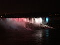 American Falls and Bridal Veil Falls lit up at night in red, white, and blue