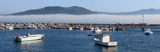 Fog on the coast. Dock of O Freixo de Sabardes, Outes, Galicia (Spain).