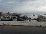Порт Мукалла. На фото: цистерны цементной компании «RAYSUT», лагом ошвартован цементовоз «Pacific Arrow» (серый корпус, белая надстройка и красная труба) и много рыболовных судов.