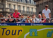 Tourists taking photos from a ParisCityVision open-topped tour bus in Paris. Paris tourists.jpg