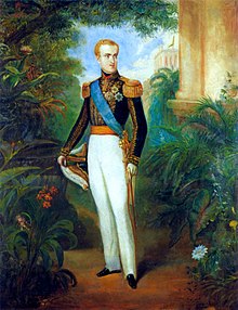 Full-length painted portrait of a blond young man standing in a garden dressed in white trousers, a military tunic with heavy gold braid, a blue sash of office, and holding a bicorn admiral's hat