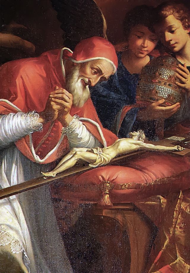 Pius V leans over a crucifix of Jesus