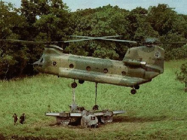 A No. 12 Squadron Chinook picking-up a Boston bomber in Papua New Guinea