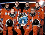 STS-115 crew portrait with Astronauts Brent W. Jett, Jr. (right) and Christopher J. Ferguson, Heidemarie M. Stefanyshyn-Piper, Joseph R. (Joe) Tanner, Daniel C. Burbank, Steven G. MacLean and the mission insignia (cropped).jpg