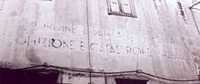 Iscrizione murale ancora visibile su una parete del centro abitato di Giardinello (PA), risalente al periodo fascista, che si pronuncia nel seguente modo: Senza ordine e senza disciplina dissoluzione e catastrofe, Mussolini.