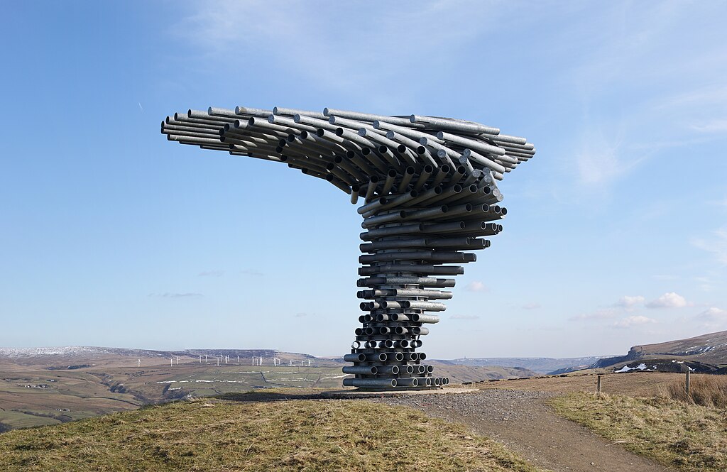 A large sculpture made of corrugated drainage pipes