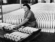 A woman stacking practice bombs at a factory in 1943 Stacking practice bombs.jpg