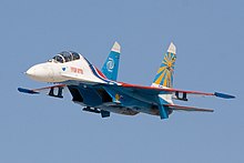 A Su-27 from the Russian Knights aerobatic team, a supermaneuverable 4th-generation jet. This jet can easily perform Pugachev's Cobra. Su-27 low pass.jpg