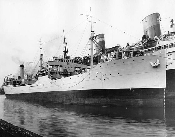 SS Manhattan (in background) undergoing conversion for Naval Service next to the USS Laramie (AO-16)