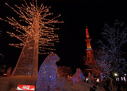 US Navy 060209-N-7526R-205 Illuminated trees and ice sculptures line the streets leading up to Sapporo