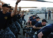 American petty officers reenact boarding pike drills US Navy 110823-N-AU127-179 Chief selectees perform boarding pike drills on the USS Constitution.jpg