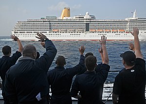 US Navy 120124-N-ZF681-268 Sailors aboard the guided-missile destroyer USS Halsey (DDG 97) wave at the cruise ship Arcadia as it passes.jpg