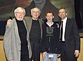 Maurice Green with nobel laureate James Watson at the National Human Genome Research Institute Symposium celebrating the 10th anniversary of completing a draft sequence of the human genome. From left to right: Maurice Green, James Watson (Nobel Laureate; former director of the National Human Genome Research Institute), grandson Joshua Green, and son Eric Green (Director, National Human Genome Research Institute).