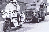 A British Army ambulance with a police escort deployed during the strike