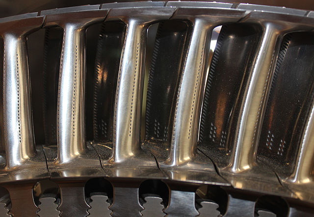Nickel-alloy high pressure turbine blades with cooling holes for use in gas hotter than their melting point