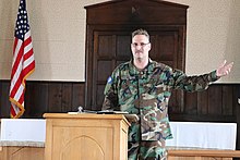 Captain Gay of the Virginia Defense Force wearing ACU pattern woodland camouflage. 210808-Z-A3554-0001 - Captain Gay of the Virginia Defense Force.jpg