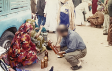 Women selling Argan oil at a Souk in Inezgane, Morocco
