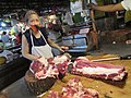 BaliuaBaliuageña market vendor selling cuts of beef in the Philippines 13