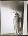 Beals standing outside in front of the entrance to her studio. Her name and unit number are painted on the wall behind her, ca. 1928-1930. (22164822734).jpg