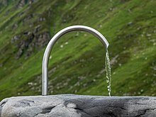 An outdoor fountain at the Barbara Chapel above the Bielerhohe mountain pass, Vorarlberg, Austria. Bielerhohe - Barbarakapelle - Brunnen 02.jpg