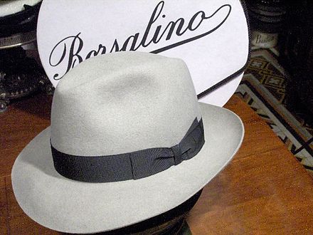 A fedora made by Borsalino with a gutter-dent, side-dented crown, the front of the brim "snapped down" and the back "snapped up"