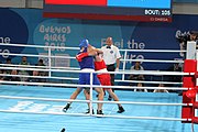 Deutsch: Boxen bei den Olympischen Jugendspielen 2018 Tag 12, 18. Oktober 2018 - Kampf um Bronze im Leichten Schwergewicht Jungen – Karol Itauma (Großbritannien, blau) schlägt Ruslan Kolesnikov (Russland, rot) 4-1; Ringrichter ist Alejandro Barrientos (Kuba). English: Boxing at the 2018 Summer Youth Olympics on 18 October 2018 – Gold Medail Match light heavyweight Boys - Karol Itauma (Great Britain, blue) beats Ruslan Kolesnikov (Russia, red) 4-1; Referee is Alejandro Barrientos (Cuba). Español: Boxeo en los Juegos Olímpicos Juveniles de Verano de 2018 en 18 de octubre de 2018 - Medalla de oro de los hombres de peso pesado ligero: Karol Itauma (Gran Bretaña, azul) vence a Ruslan Kolesnikov (Rusia, rojo) 4-1; El árbitro es Alejandro Barrientos (Cuba).