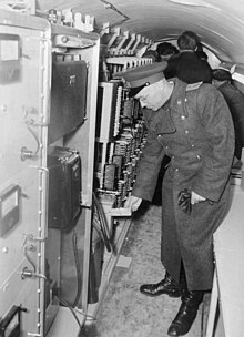 Soviet officer inside the tunnel Bundesarchiv Bild 183-37695-0003, Altglienicke, Sowjetischer Offizier in Spionagetunnel.jpg