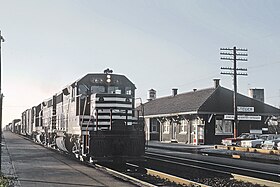 Chicago and Eastern Illinois 265 (GP35) passing the Steger, IL Depot on November 26, 1965 (27482523861).jpg
