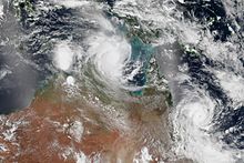 Satellite image of Lam (top-center) and Marcia (right) making near-simultaneous landfalls Cyclones Lam and Marcia.jpg