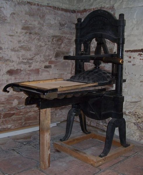 An early News printing press displayed in the statehouse basement
