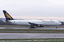 Side view of an Eritrean Airlines 767-300ER, showing CF6 engines E3-AAO 1 B767-366ER Eritrean Al MAN 27DEC04 (6714580339).jpg