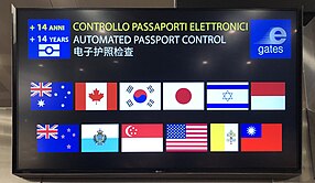 eGate eligibility screen in Venice Airport (showing the flags of Australia, Canada, South Korea, Japan, Israel, Monaco, New Zealand, San Marino, Singapore, USA, Vatican City, and Taiwan) (EU, EEA and Swiss citizens using eGates have a different line) EGate eligibility screen in Venice.jpg