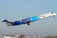 A Nordica Bombardier CRJ900 departing Warsaw Chopin Airport