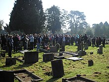 Fan gathering at Tolkien's gravesite during the 2008 Oxonmoot. Fan gathering at Tolkien's gravesite.jpg