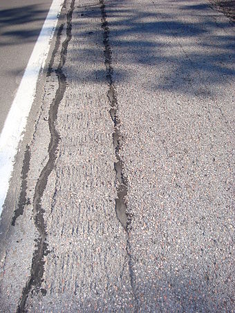 An example of extensive cracking in rumble strips due to frost jacking on Interstate Highway 81 north of Syracuse.  These parallel cracks were sealed.  There were other sections with grass and weeds growing up through the rumble strip cracks