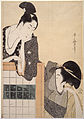 Two women inspecting silk