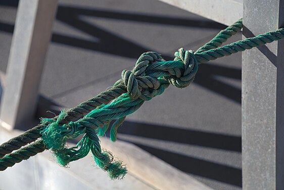 Rope with nots at the pier of Ilha Deserta, Faro, Portugal