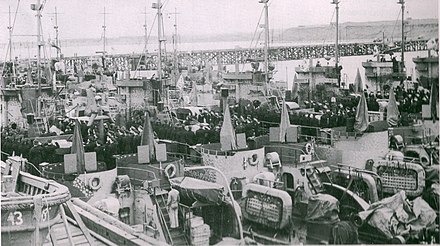 The Soviet naval ensign is raised aboard the LCI(L)s at Cold Bay, as they are commissioned into the Soviet Navy, immediately after their transfer on 9 June 1945. Redesignated desantiye suda (DS) or "landing ship," these craft saw action against Japanese forces during the Soviet campaign in northern Korea in August–September 1945.[17]