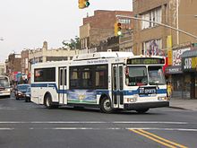 A westbound Q43 bus turning onto Sutphin Boulevard in Jamaica. MTA New York City Bus Orion VII hybrid (2004).jpg