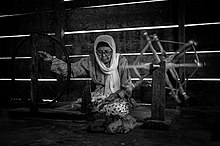 Manuriang is spinning yarn for weaving. A grandma doing Manuriang in Pandai Sikek, West Sumatra Manuriang.jpg