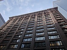 Historically unprecedented grid of wide windows, clear expression of structural frame, and minimalist ornamentation on the Marquette Building (1895). Marquette Building - Chicago IL (7833796194).jpg