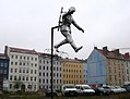 Sculpture called the Mauerspringer (Wall jumper) marking the spot at the corner of Ruppiner Straße and Bernauer Straße where the historic defection of East German soldier Conrad Schumann took place where he jumped over the barbed wire marking the border between East and West Berlin on 15 August 1961.