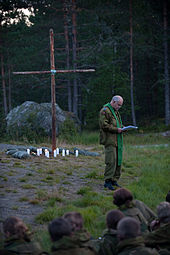 Military chaplain of the Norwegian Army in front of a Christian Cross, Oslo, 2010. Military chaplain of the Norwegian Army.jpg