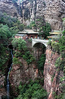 Mount Cangyan, including the bridge pictured above, was one of many filming locations. Mount cangyan 2007.jpg