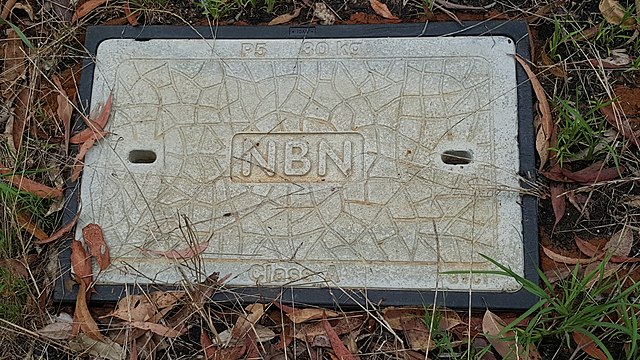 A concrete pit cover for an underground NBN service
