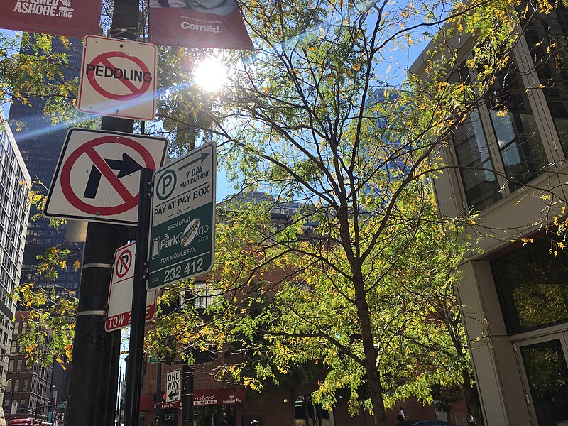 File:No peddling, no right turn, 7 day paid parking, tow zone (38222525652).jpg