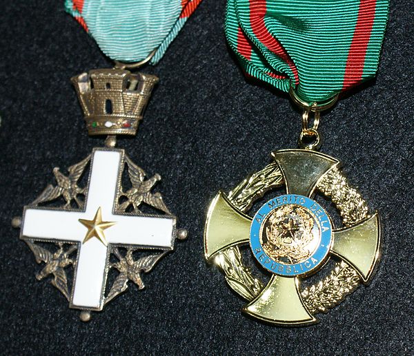 Comparison of the pre-2001 (at left) and the post-2001 (at right) badges of the Order.