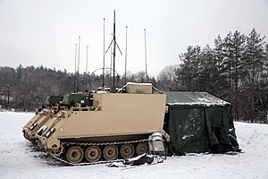 U.S. Soldiers assigned to Alpha Battery 1-142nd Field Artillery Brigade conduct artillery strike missions during Combined Resolve XV at Grafenwoehr Training Area, Germany, Feb. 9, 2021. Preparing for artillery strike mission 210209-A-FR580-1001.jpg